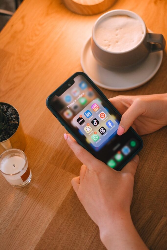 Someone is using their phone with social media apps